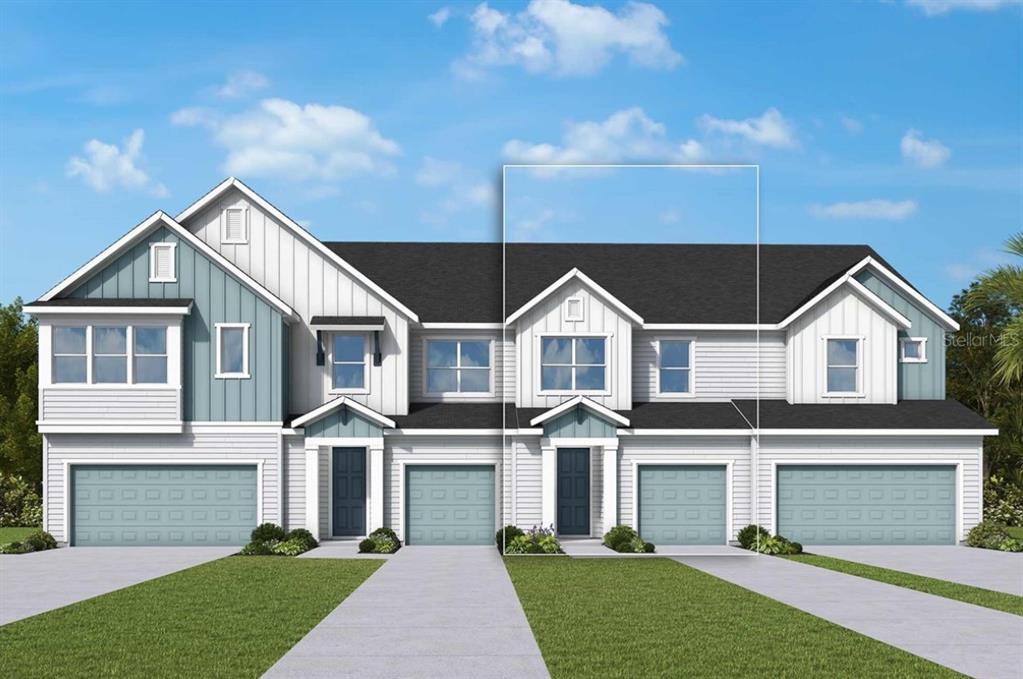 The exterior of a multi-unit townhouse construction site features light-colored siding and open garage bays — 6353 JENSEN VIEW AVENUE, APOLLO BEACH, FL