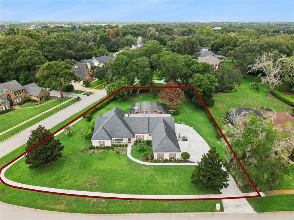 An aerial view shows a single-story house with a screened pool on a large lot — 2512 TRYON PLACE, WINDERMERE, FL