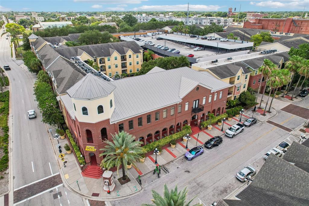 An aerial view shows a multi-story apartment complex with a central parking garage — 1810 E PALM AVENUE UNIT 5322, TAMPA, FL