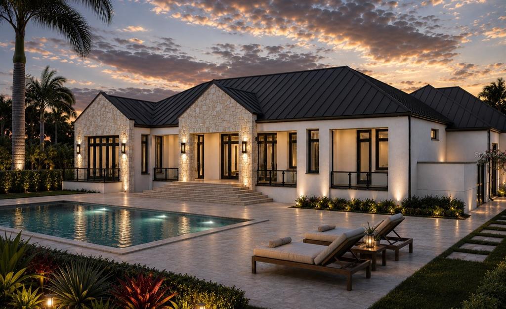 A modern single-story house with a stone facade, metal roof, and a swimming pool at dusk — 215 LAKE BRANT DRIVE, LUTZ, FL