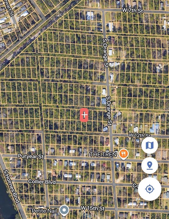 This is a satellite map view showing a vacant lot marked with a red pin — 901 W 11TH STREET, ST AUGUSTINE, FL