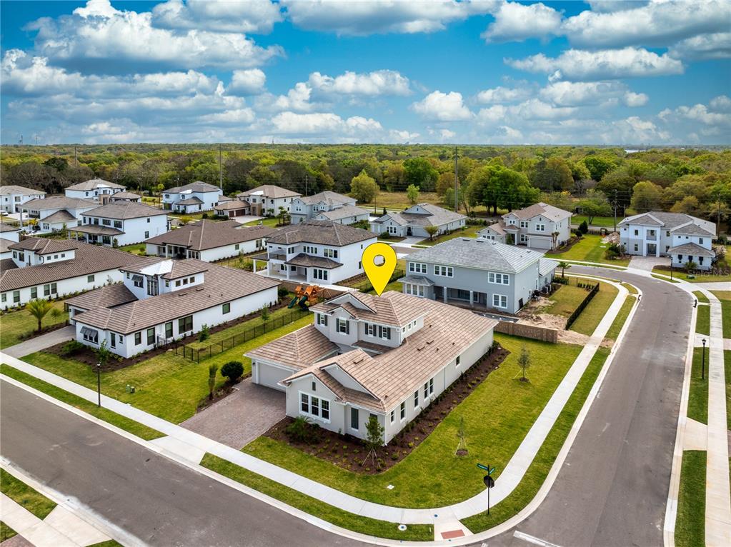 An aerial view shows a suburban house with a tile roof and a yellow location marker — 10176 BROCKSPORT CIRCLE, GOTHA, FL