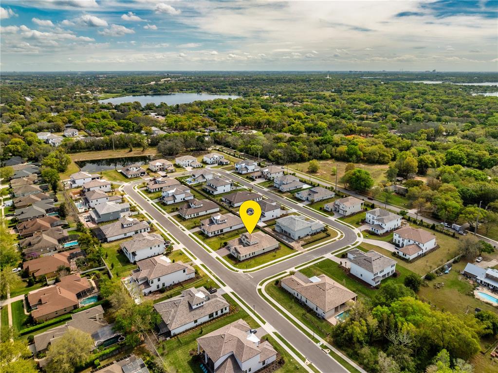 An aerial view shows a suburban neighborhood with single-family homes and a yellow location marker — 10176 BROCKSPORT CIRCLE, GOTHA, FL