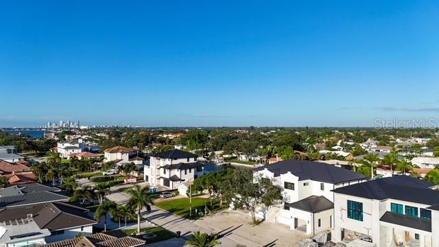 An aerial view of waterfront homes with private docks along a canal leading to the bay — 2051 ILLINOIS AVENUE NE, ST PETERSBURG, FL