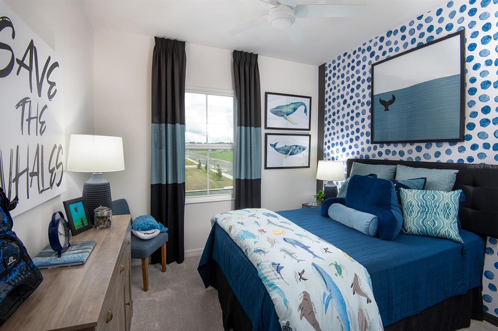 A bedroom features a whale-themed wall, blue bedding, and a window with dark curtains — 1532 SILVER LINING WAY, APOPKA, FL