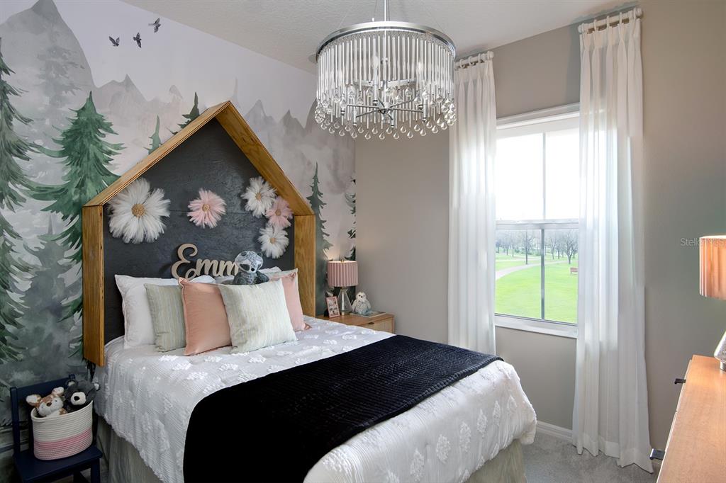 A bedroom features a house-shaped headboard, a crystal chandelier, and a mountain-themed mural — 1532 SILVER LINING WAY, APOPKA, FL