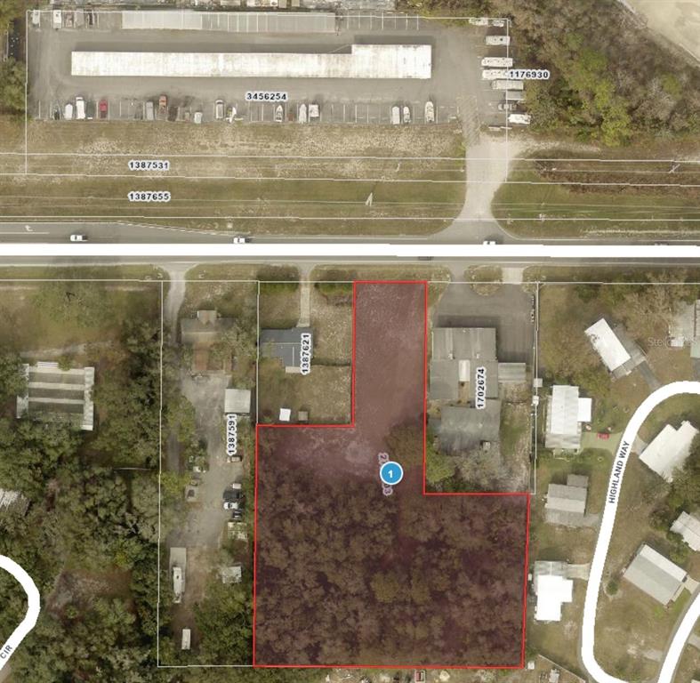 An aerial map view shows a vacant, rectangular lot highlighted in red — COUNTY ROAD 44, LEESBURG, FL