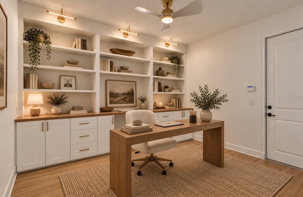 A modern open-concept living room and kitchen featuring a large sectional sofa and tile floors — 5785 SAYBROOK CIRCLE, SANFORD, FL