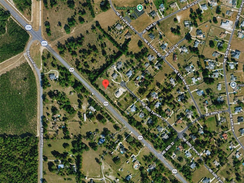 This is an aerial map view showing a residential lot marked with a red pin — X, SILVER SPRINGS, FL