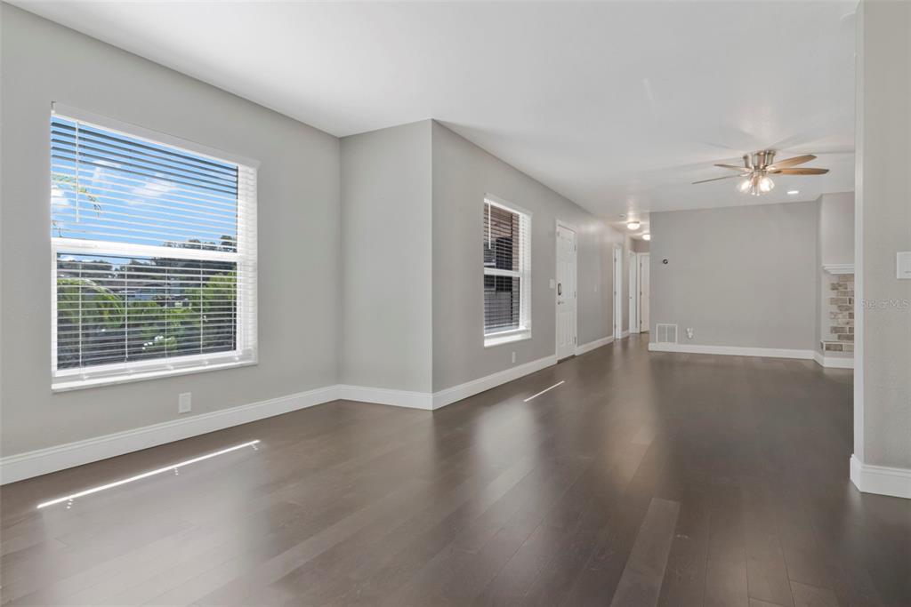 A single-story ranch-style house with a brick driveway and a large front yard — 712 S OAKWOOD AVENUE, BRANDON, FL
