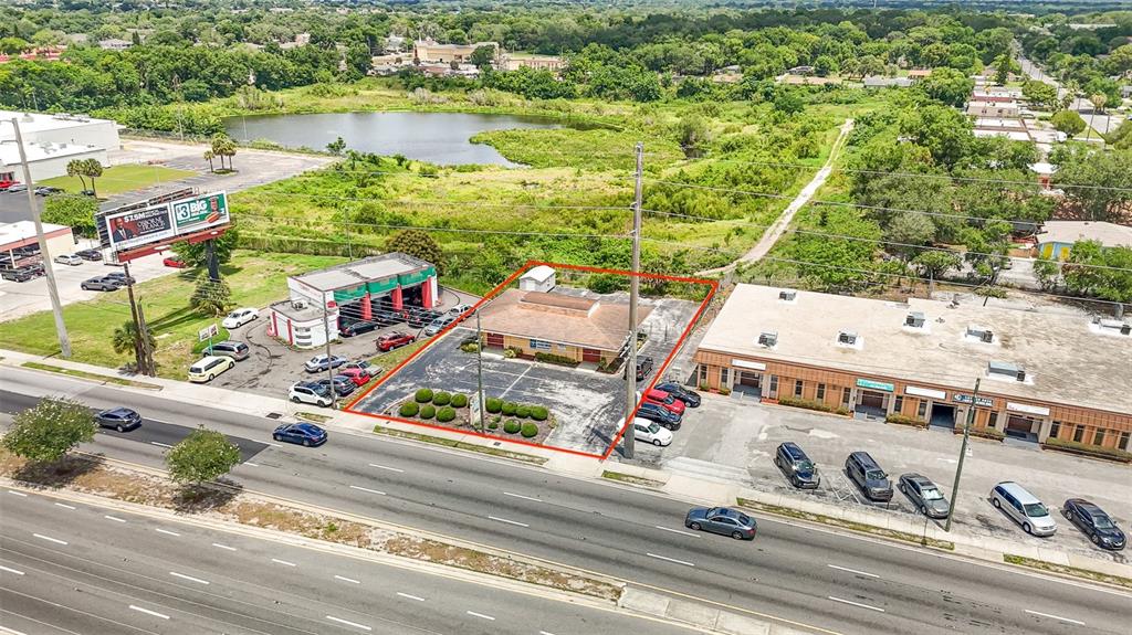 An aerial view shows a commercial property outlined in red along a multi-lane road — 6005 SILVER STAR ROAD, ORLANDO, FL