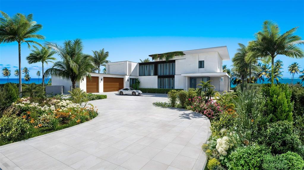 This is a rendering of a modern white house with a driveway and palm trees — Atlantic Drive BEACHFRONT LOT ATLANTIC DRIVE AT THE FOUR SEASONS Lot 12, RIO GRANDE, PR