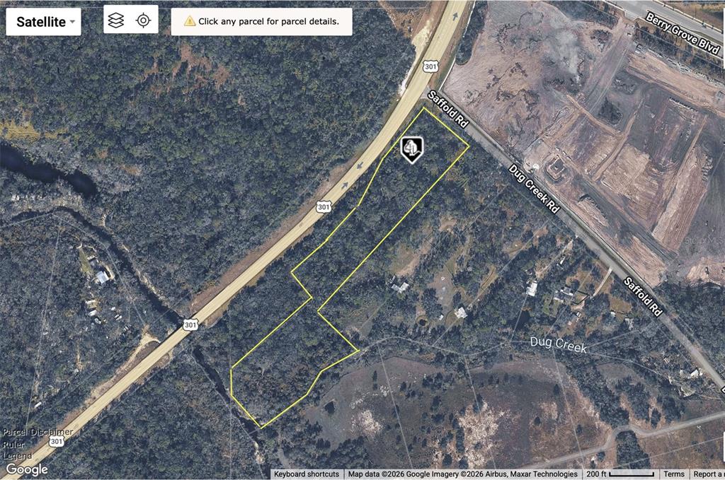 This is a satellite map view showing a highlighted parcel of land near a highway — 2819 SAFFOLD ROAD, WIMAUMA, FL