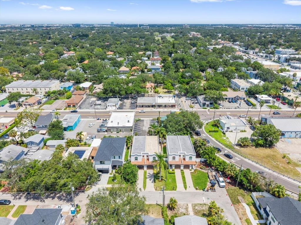 An aerial view shows a residential duplex highlighted in red within a suburban neighborhood — 3203 W SANTIAGO STREET UNIT B, TAMPA, FL
