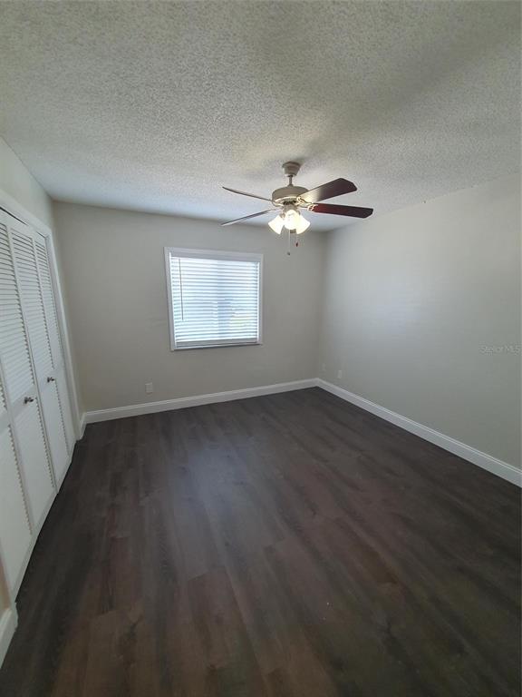 A small laundry closet features plumbing hookups and a recessed wall box for a dryer vent — 1907 ORANGE BOULEVARD WAY, PALM HARBOR, FL