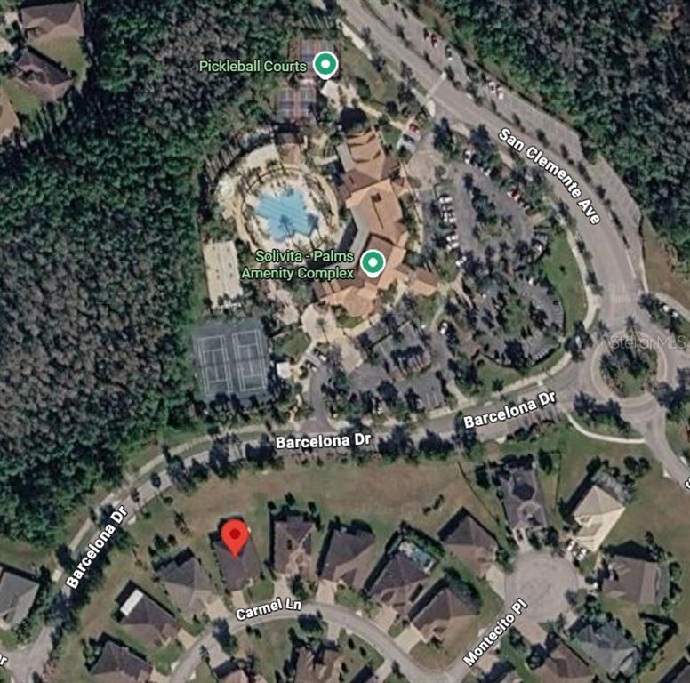 This is an aerial map view showing a residential neighborhood and a nearby amenity complex — 766 CARMEL LANE, KISSIMMEE, FL