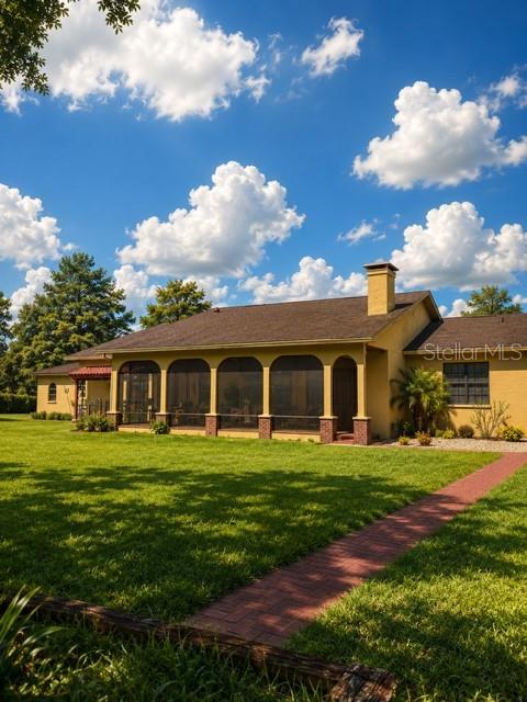 An aerial view of a single-story house with a brown roof and attached garage — 4020 N WILDER ROAD, PLANT CITY, FL