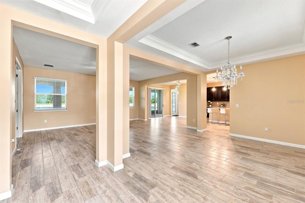 An aerial view shows a suburban house with a white location pin by a pond — 10708 PLANER PICKET DRIVE, RIVERVIEW, FL