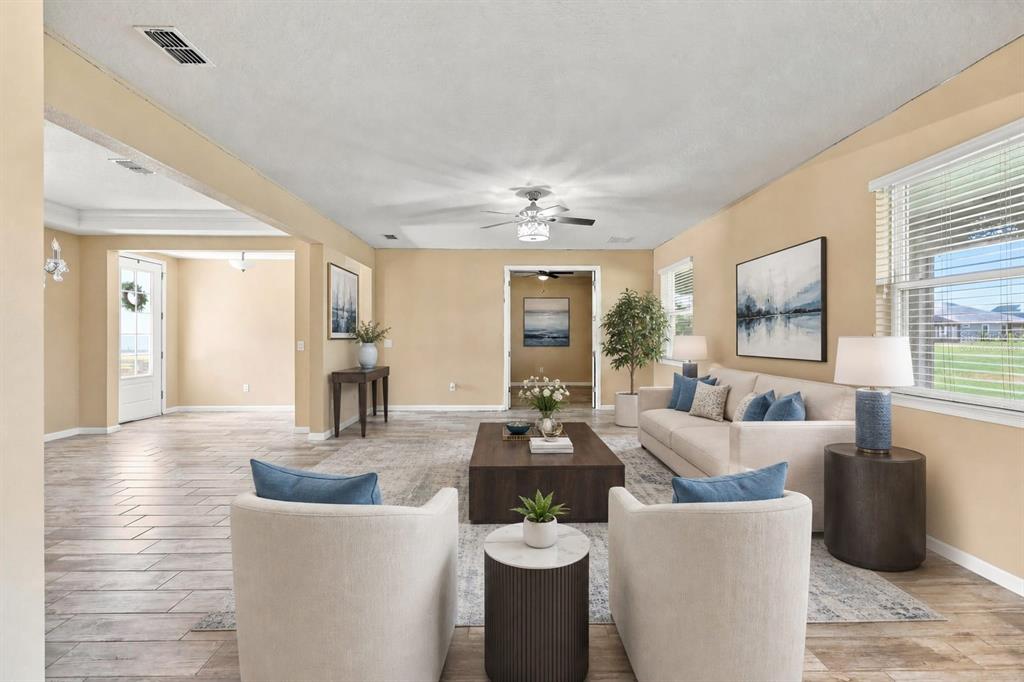 An aerial view shows a suburban house with a white location pin overlooking a lake — 10708 PLANER PICKET DRIVE, RIVERVIEW, FL