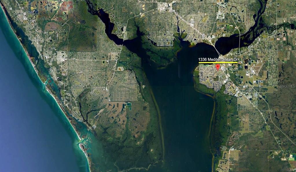 This is a satellite map view showing a residential area located on a peninsula — 1336 MEDITERRANEAN DRIVE, PUNTA GORDA, FL