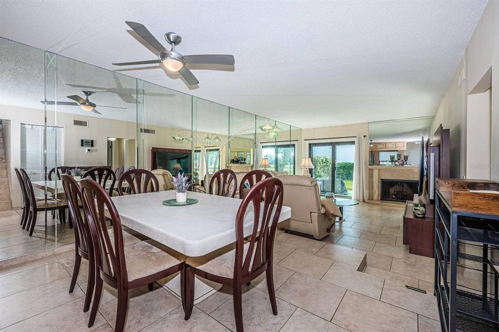 A view of a grassy lawn, a small pond, and palm trees on a golf course — 6260 SUN BOULEVARD UNIT 1, ST PETERSBURG, FL