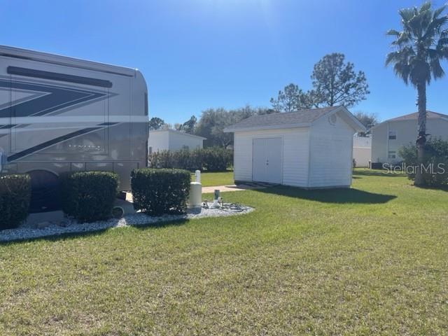 This is a digital map showing property parcel boundaries and dimensions for a specific area — 1064 CARAVAN LOOP, POLK CITY, FL