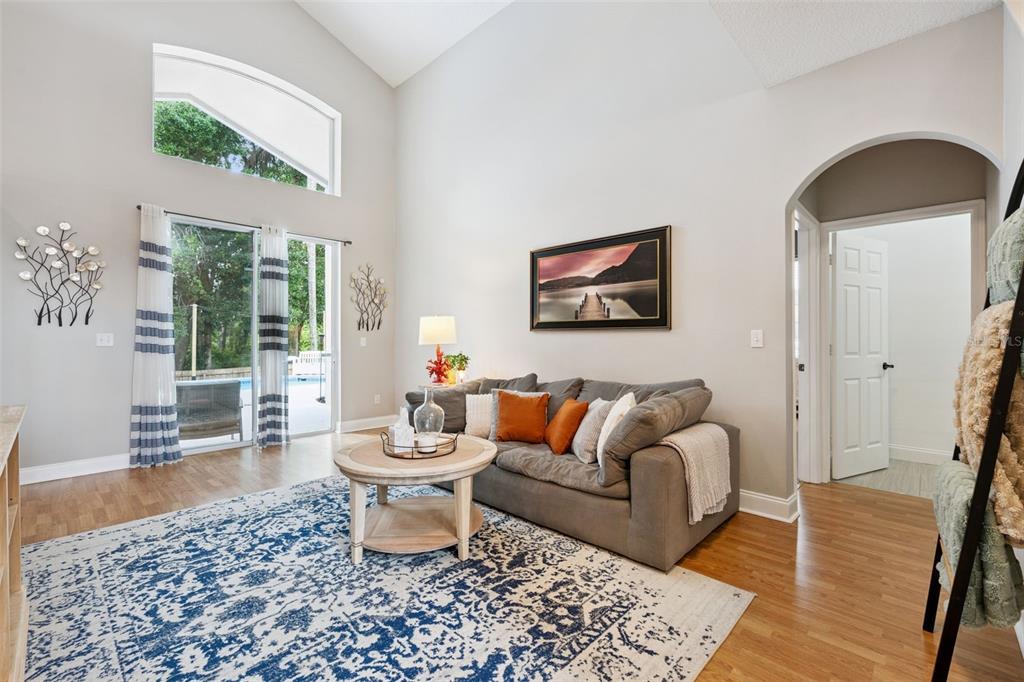 An entryway features a dark double front door, tile flooring, and French doors to an office — 2563 WALNUT HEIGHTS ROAD, APOPKA, FL