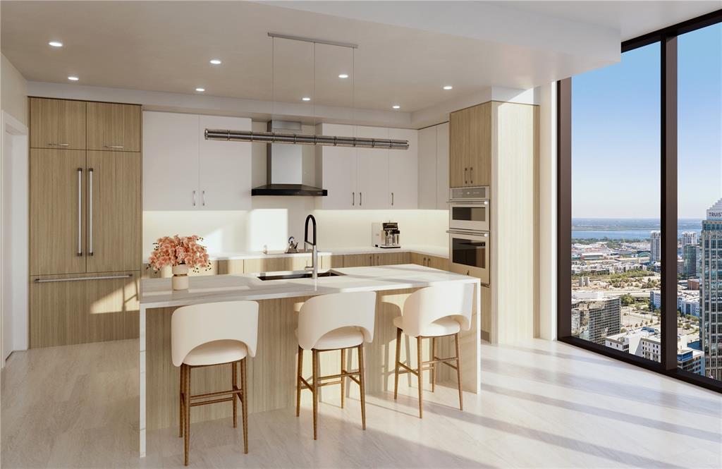 This rendering shows a modern kitchen with light wood cabinetry, a white island, and city views — 520 N TAMPA ST UNIT 3308, TAMPA, FL