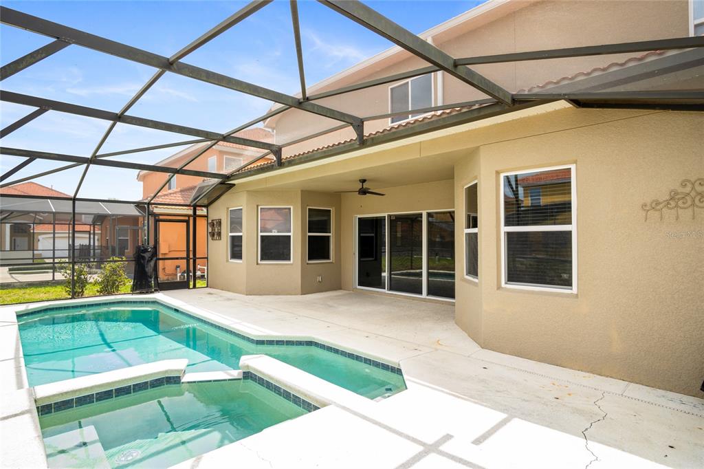This is a floor plan of a home featuring a primary suite, living areas, and patio — 118 MIRO DRIVE, DAVENPORT, FL