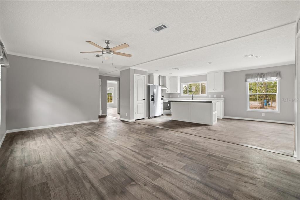 An aerial view shows a house situated on a large, sandy, partially wooded lot — 20213 NW 258TH STREET, OKEECHOBEE, FL