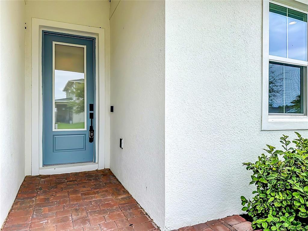 An empty bedroom features beige walls, light-colored carpeting, recessed lighting, and a single window — 3540 STONEBRIAR LANE, SANFORD, FL