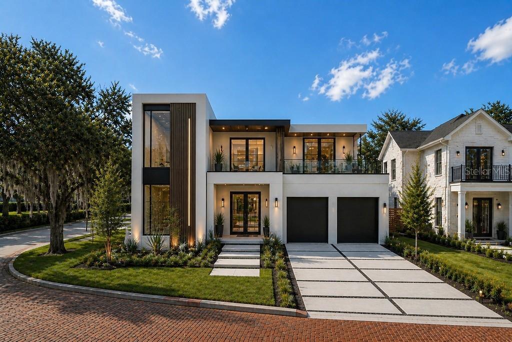A modern two-story house with a flat roof, glass balcony, and two-car garage — 230 KILLARNEY DRIVE, WINTER PARK, FL
