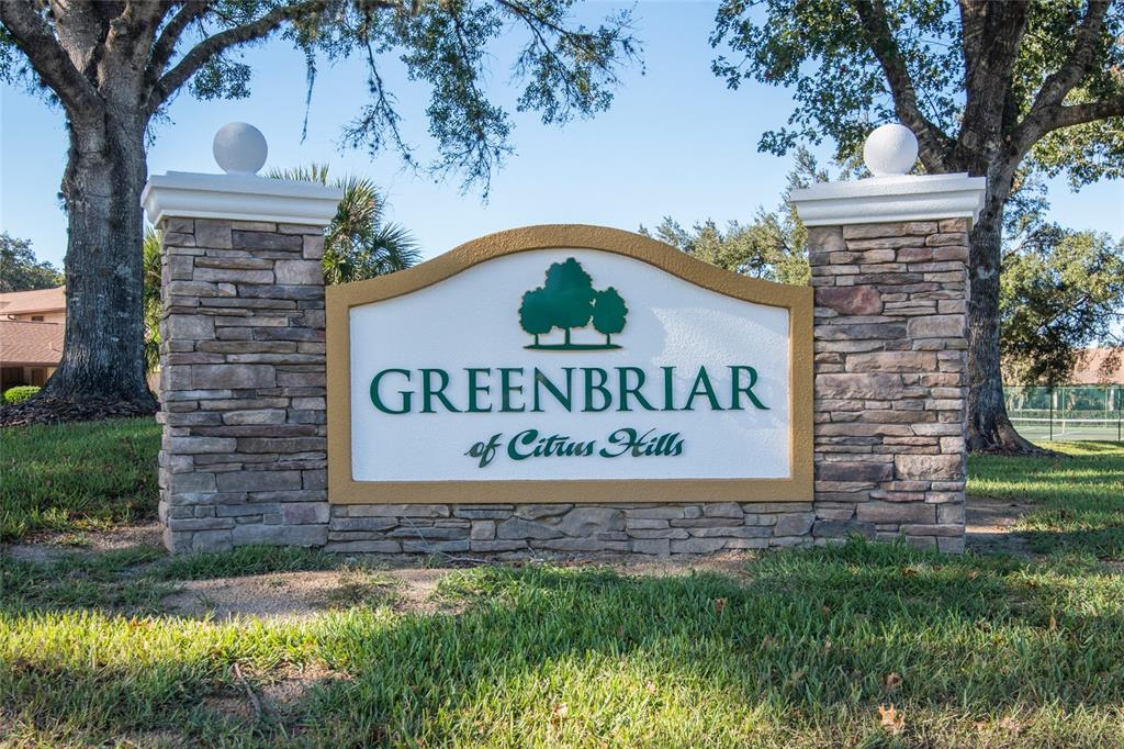 A stone monument sign for Greenbriar of Citrus Hills stands on a grassy lawn — 95 E HARTFORD STREET UNIT 7A, HERNANDO, FL