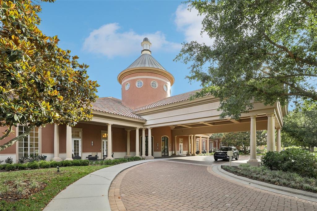 A hallway with tile flooring leads to a living area featuring a baby grand piano — 508 NARROW VIEW LANE, GROVELAND, FL