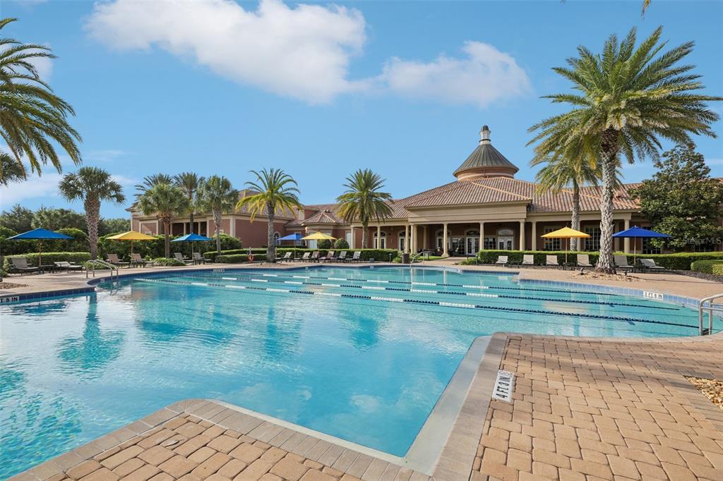 A grand piano sits in a room with wood floors, a ceiling fan, and a dresser — 508 NARROW VIEW LANE, GROVELAND, FL
