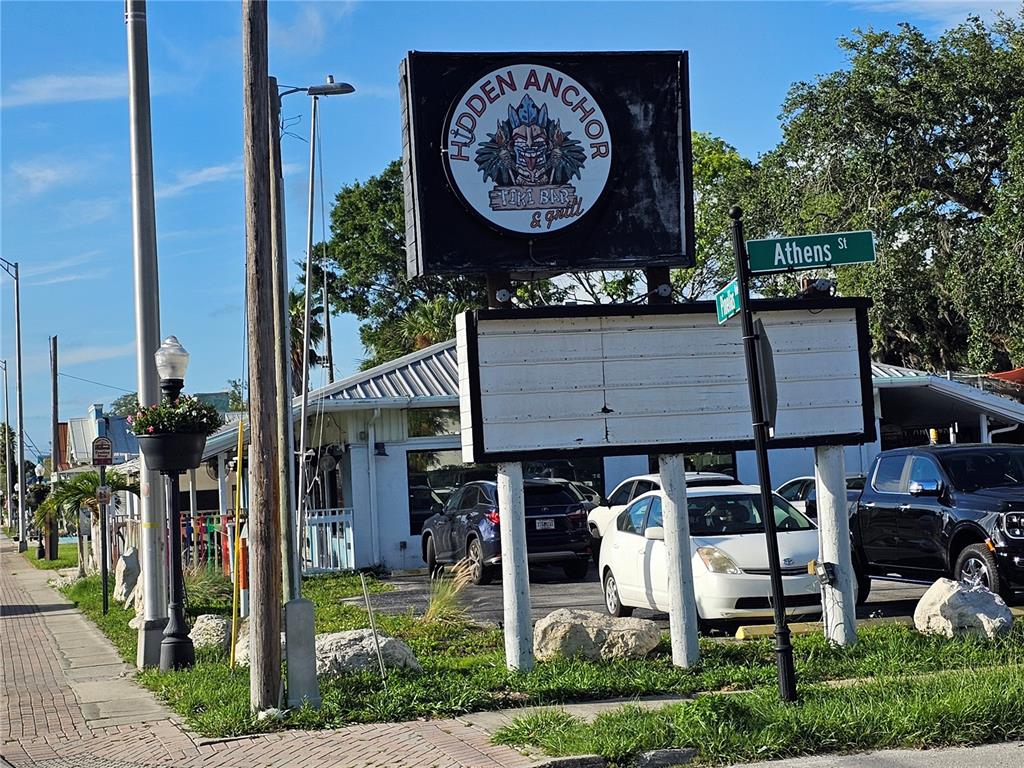 A street-level view shows the exterior of the Hidden Anchor Tiki Bar and Grill — 606 N PINELLAS AVENUE, TARPON SPRINGS, FL