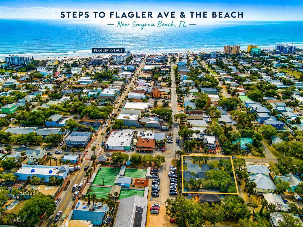 An aerial view shows a residential property marked with an arrow near a coastal bridge — 200 S PINE STREET, NEW SMYRNA BEACH, FL