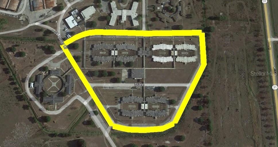 This aerial map shows a fenced-in facility with multiple large buildings and surrounding grounds — 5871 SE HIGHWAY 31 UNIT 12, ARCADIA, FL