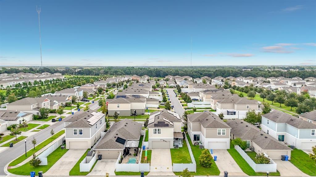 An aerial view shows a suburban neighborhood with rows of single-family houses and green lawns — 13005 UPWARD PLACE, RIVERVIEW, FL