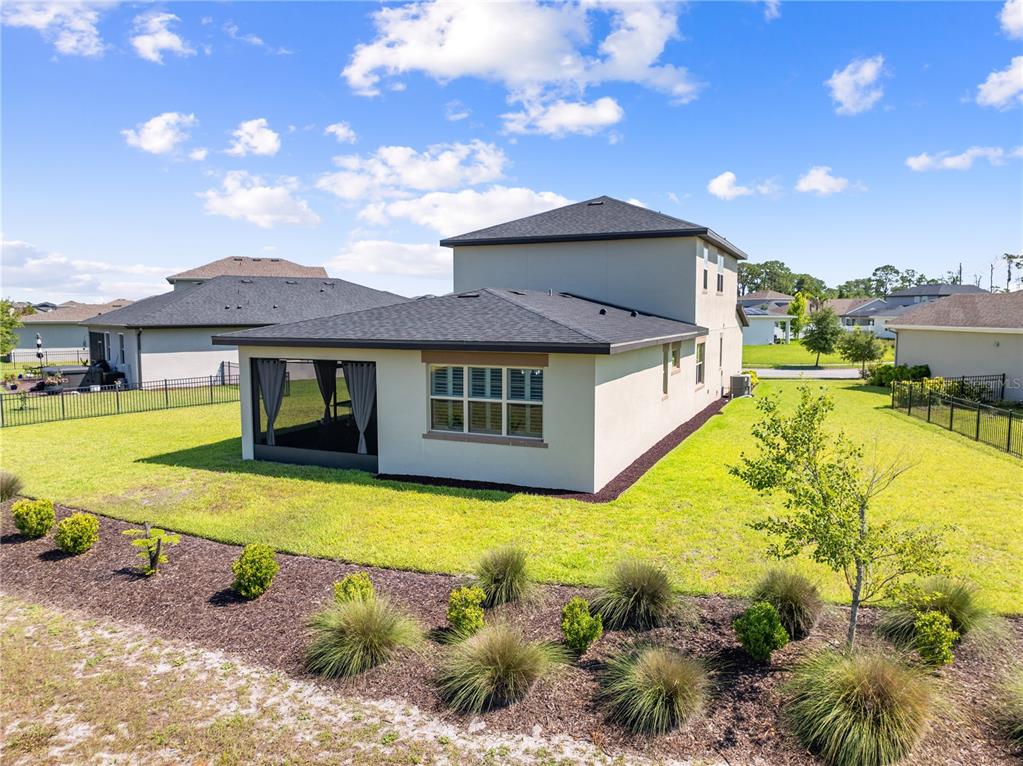 A two-story house with a screened-in patio and a fenced backyard — 3120 CRISPIN, ST CLOUD, FL