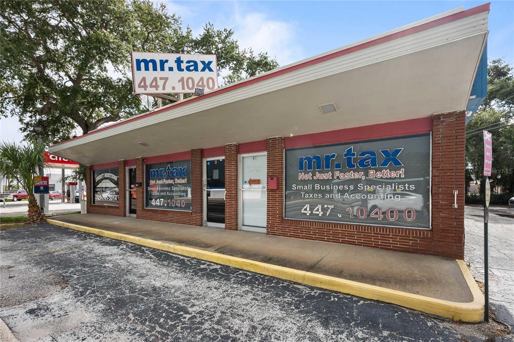 The exterior of a brick commercial building features signage for a tax and accounting business — 1311 S MISSOURI AVENUE, CLEARWATER, FL