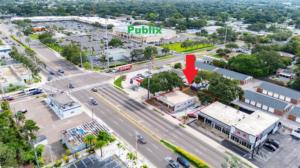 An aerial view shows a commercial property outlined in red near a Publix supermarket — 1311 S MISSOURI AVENUE, CLEARWATER, FL
