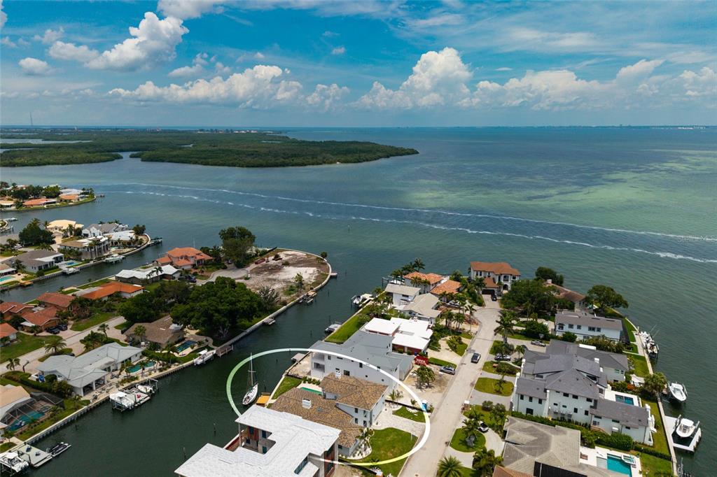 A white two-story house with a swimming pool and a paved patio area — 2063 ILLINOIS AVENUE NE, ST PETERSBURG, FL