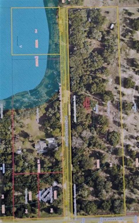 This aerial map shows property boundaries outlined in yellow over a wooded lot and lake — 0 SOUTH LAKE HIAWATHA DRIVE, LADY LAKE, FL