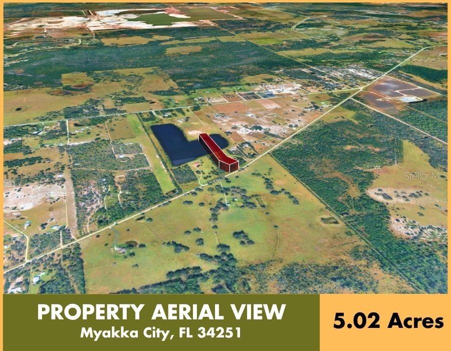 An aerial view shows a rectangular plot of land highlighted in red near a pond — 4952 WAUCHULA ROAD, MYAKKA CITY, FL