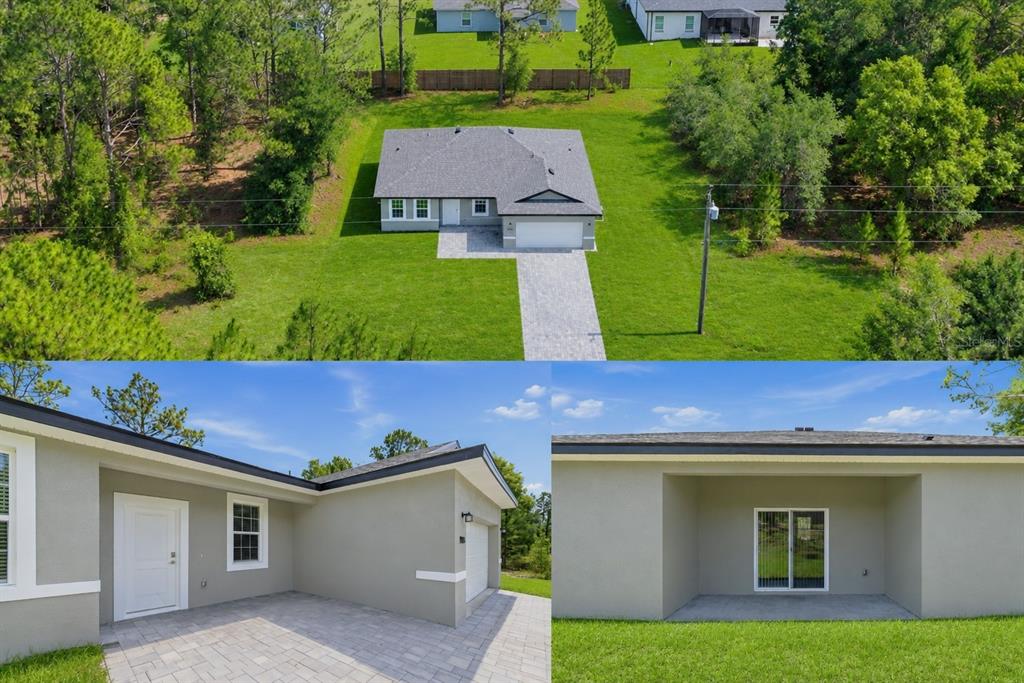 A single-story house with a gray stucco exterior, a white garage door, and a paved driveway — 1985 W CORRINE STREET, DUNNELLON, FL