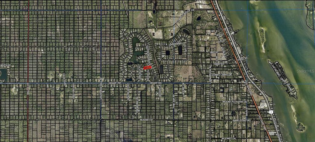 This is an aerial map showing a residential neighborhood with a highlighted property lot — 5690 CYPRESS CREEK DRIVE, GRANT VALKARIA, FL