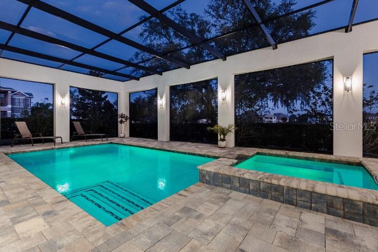 A two-story stucco house with a red tile roof and an attached garage — 1253 RADIANT STREET, REUNION, FL