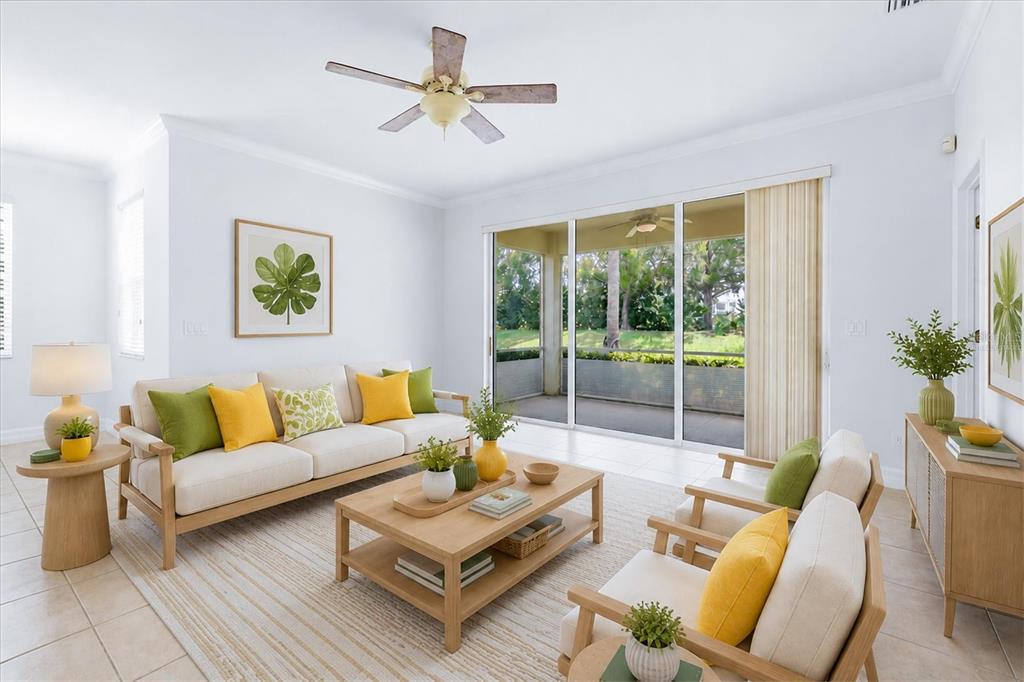 A bright living room features light wood furniture, a sofa, two armchairs, and sliding glass doors — 11487 52ND COURT E, PARRISH, FL