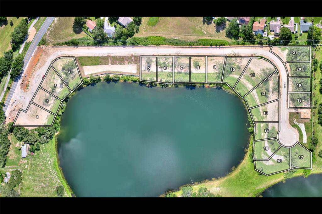 This is an aerial map of a residential development featuring numbered lots surrounding a lake — 146 TRANQUIL MIRROR LAKE COURT Lot 19, CLERMONT, FL